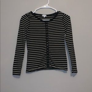 A white and black stripped button down long sleeve